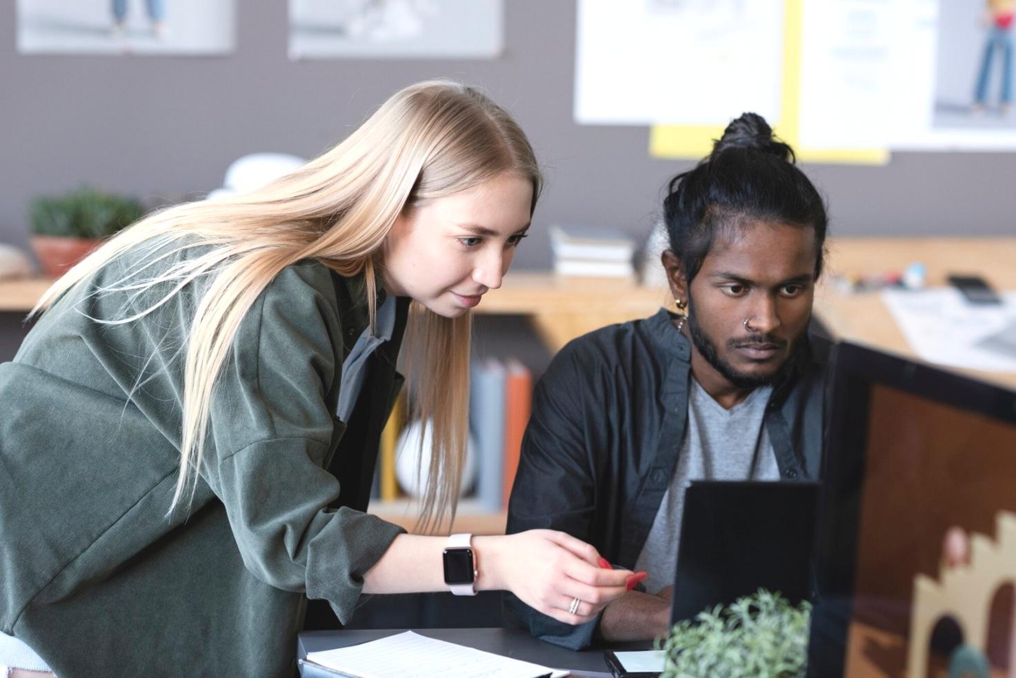 Student reviewing investment portfolio performance on laptop